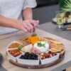 Cheese Cutting Board with cheese nuts and biscuits