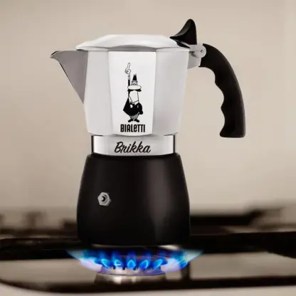 Bialetti Brikka Coffee Maker brewing coffee on a gas hob