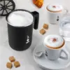 Bialetti Tuttocrema Manual Milk Frother full of frothed milk and two cappuccinos