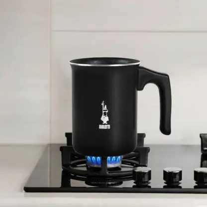 Bialetti Tuttocrema Manual Milk Frother on a gas hob