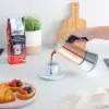 Pouring a cup fo coffee from Bialetti Venus Copper Moka Pot