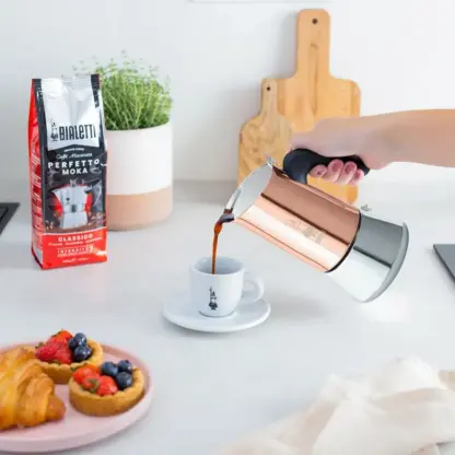 Pouring a cup fo coffee from Bialetti Venus Copper Moka Pot