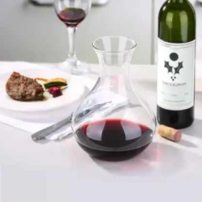Clear Glass Pitcher With Handle in table arrangement filled with red wine
