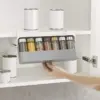Under Shelf Spice Rack mounted under shelf with various spices in rack