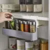 Under Shelf Spice Rack unfolded with spice bottle being removed