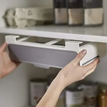 Under Shelf Spice Rack being fitted under shelf