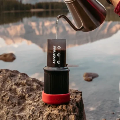 AeroPress Go Travel Coffee Maker pouring water over the brew