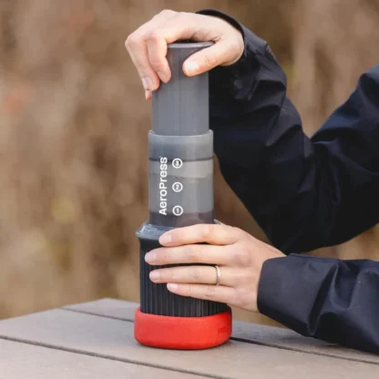 AeroPress Go Travel Coffee Maker pressing down on plunger