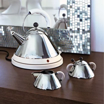 Alessi Michael Graves Electric Kettle in white on table top with creamer and sugar bowl