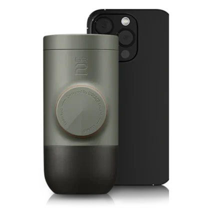 Minipresso GR2 Coffee Maker with mobile phone in background showing the size of the minipresso