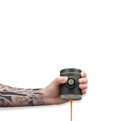 Picopresso Portable Espresso Machine person brewing espresso holding the cofeemaker in one hand