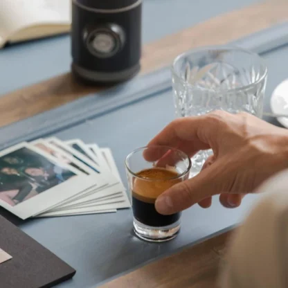 Picopresso Portable Espresso Machine shown with a drawn espresso