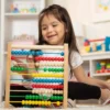 Child playing with Abacus Classic Wooden Toy