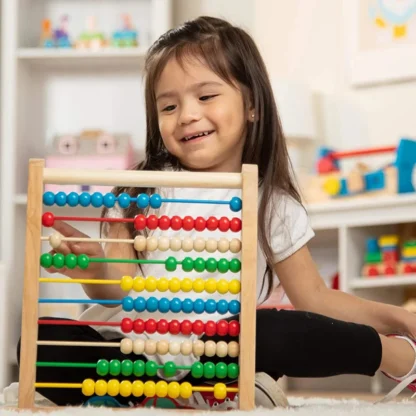 Child playing with Abacus Classic Wooden Toy