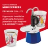Bialetti Mini Express Kandinsky Moka Pot with one cup on the platform and another next to it. Text: Coffee maker MINI Express Premium quality - Ergonomic handle for a safe grip. Exclusive porcelain cups inspired to Kadinsky's Art.