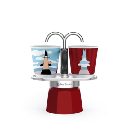 Bialetti Mini Express Magritte Moka Pot with two cups on platform.