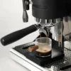 Black Mirror Mini Coffee Scale – Ultra-Thin Precision for Espresso & Pour-Over measuring the pour rate of a espresso