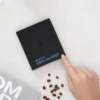 Black Mirror Mini Coffee Scale – Ultra-Thin Precision for Espresso & Pour-Over digital display with coffee beans in the foreground