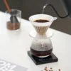 Black Mirror Mini Coffee Scale – Ultra-Thin Precision for Espresso & Pour-Over measuring a pour over being poured