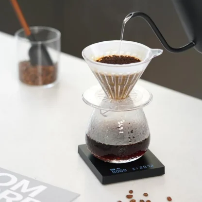 Black Mirror Mini Coffee Scale – Ultra-Thin Precision for Espresso & Pour-Over measuring a pour over being poured