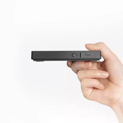 Black Mirror Mini Coffee Scale – Ultra-Thin Precision for Espresso & Pour-Over held in hand showing the ultra thin design