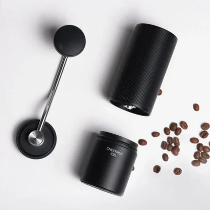 Chestnut C2S Portable Manual Coffee Grinder on it side and split in its three major parts