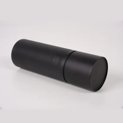 Chestnut X-lite Manual Portable Coffee Grinder lying flat on a table