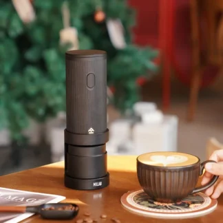 Millab 01 Portable Electric Coffee Grinder on a table with a cappuccino in the foreground