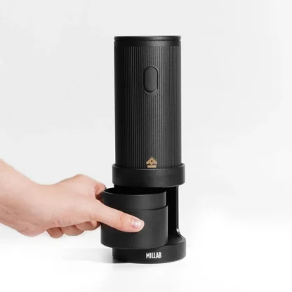 Showing the convenient grounds cup of the Millab 01 Portable Electric Coffee Grinder