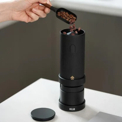Filling the Millab 01 Portable Electric Coffee Grinder with coffee beans
