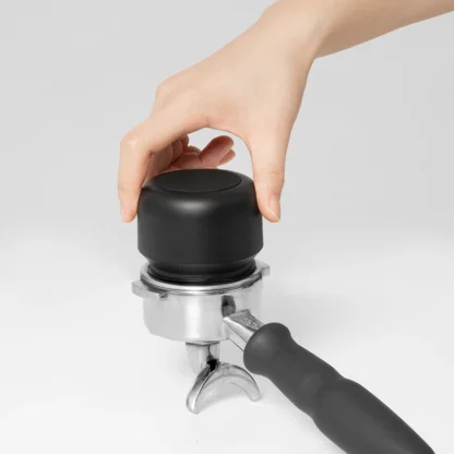 Whirly 01S Portable Electric Coffee Grinder ground cup on portafilter